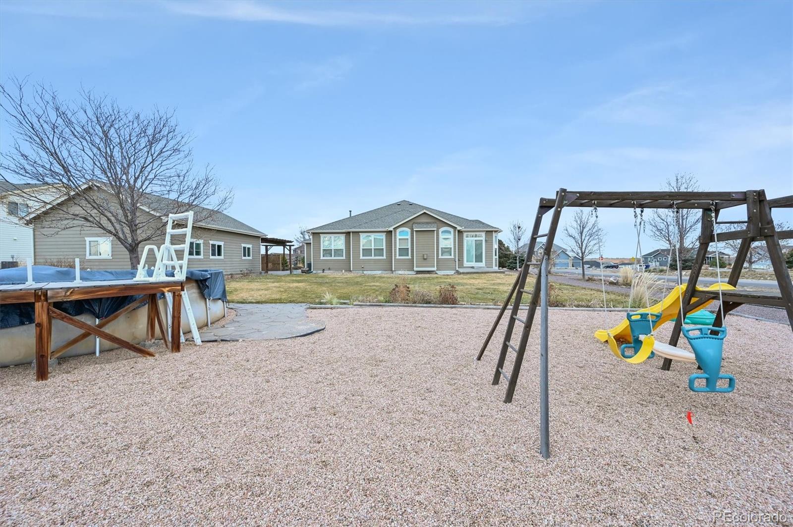 16231 Rayburn Street Hudson, CO 80642 - Photo 46 of 50 a view of swimming pool with sitting area
