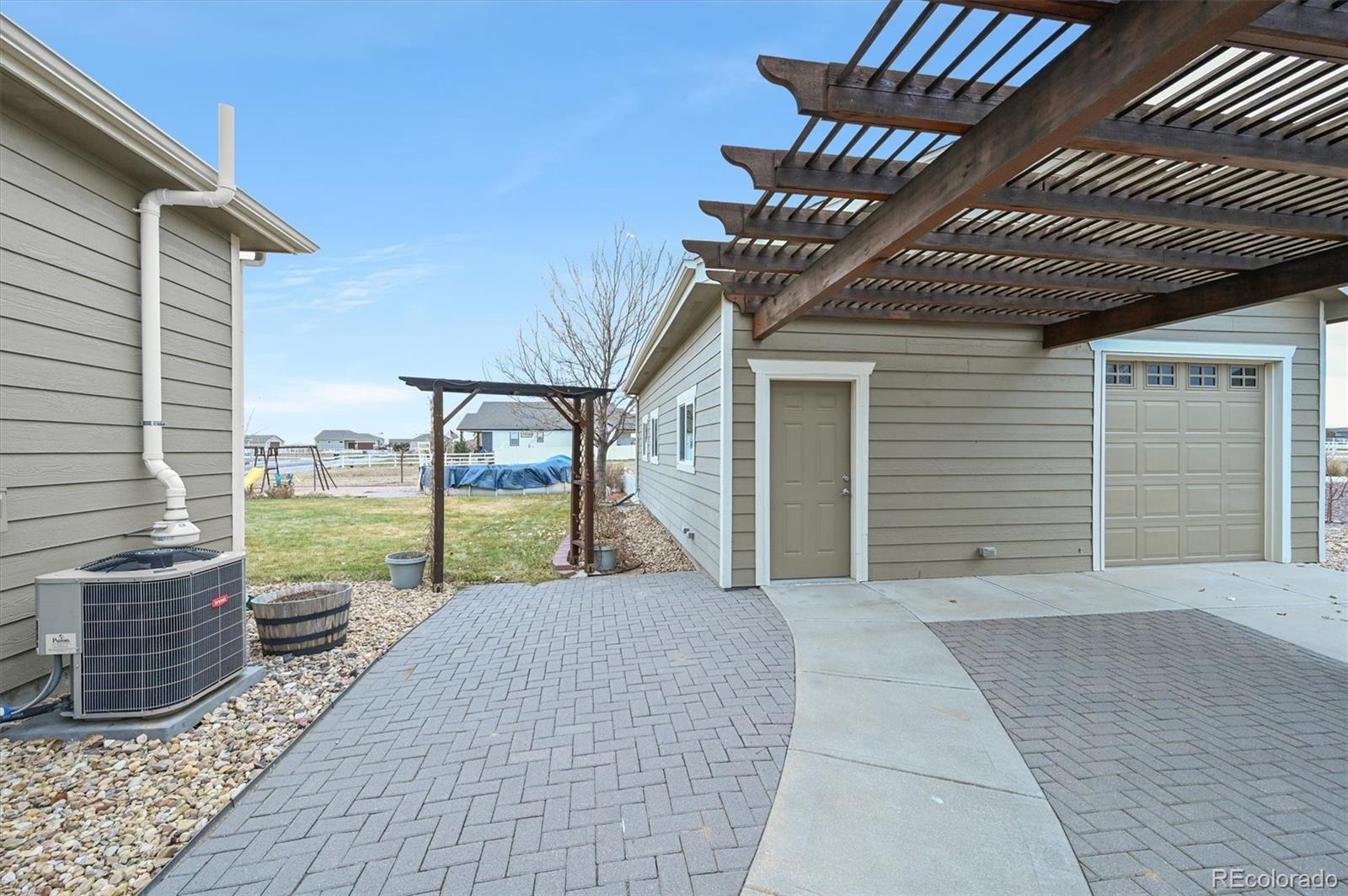 16231 Rayburn Street Hudson, CO 80642 - Photo 48 of 50 a view of a house with backyard and porch
