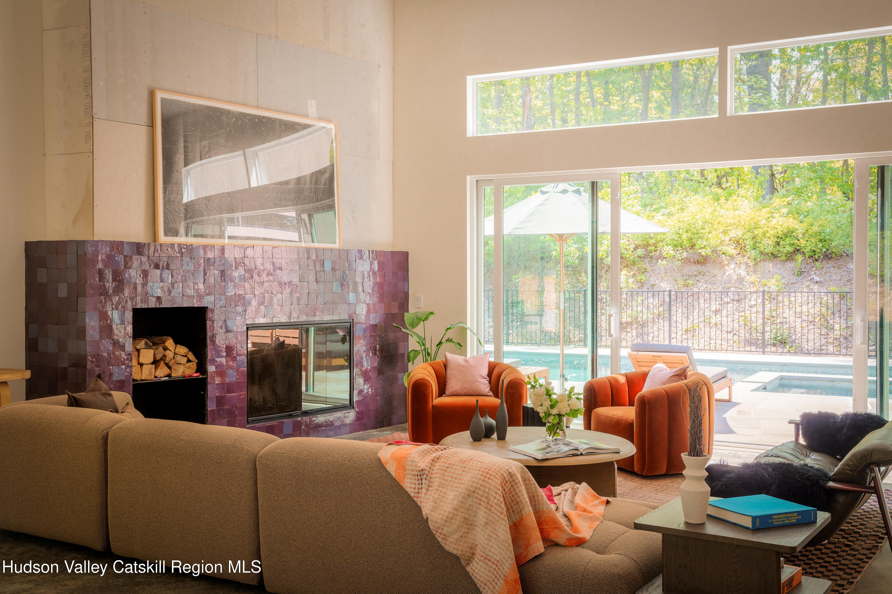 54 Langridge Road Tivoli, NY 12583 - Photo 17 of 40 a living room with furniture a large window and a fireplace