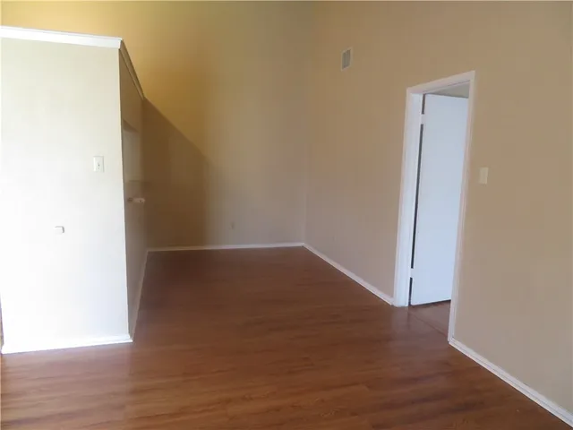 a view of a small space with wooden floor