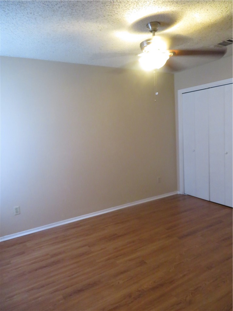 3709 Leafield Drive, Unit A Austin, TX 78749 - Photo 9 of 10 a view of an empty room with wooden floor