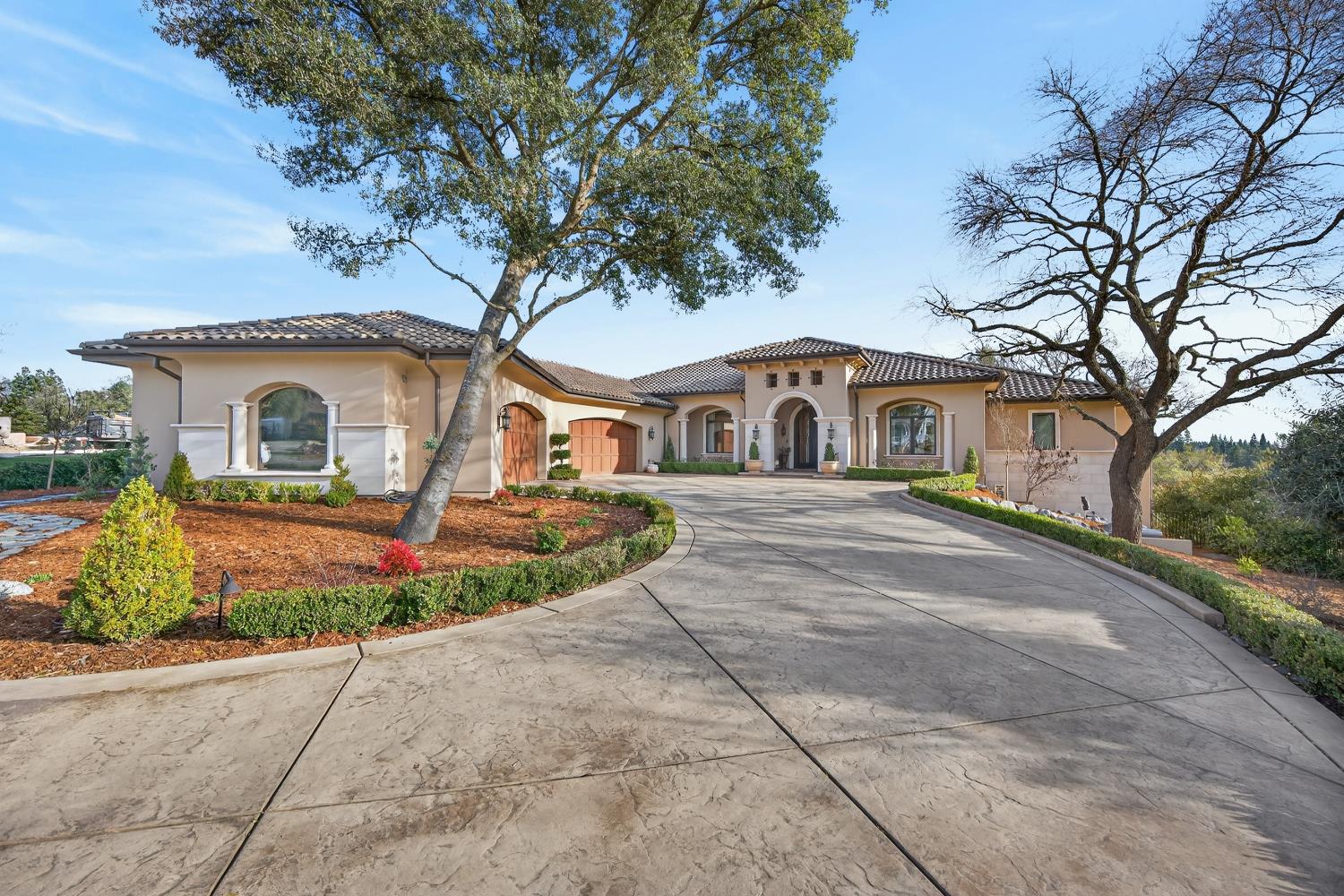 3909 Edgevale Court Fair Oaks, CA 95628 - Photo 15 of 98 a front view of a house with a garden and trees