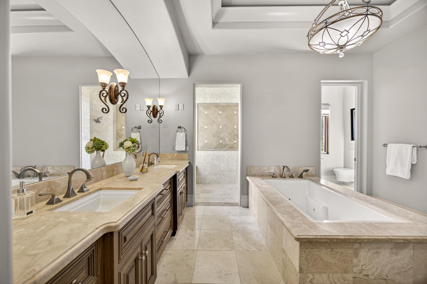 3909 Edgevale Court Fair Oaks, CA 95628 - Photo 43 of 98 a spacious bathroom with a sink double vanity granite tub shower and a mirror