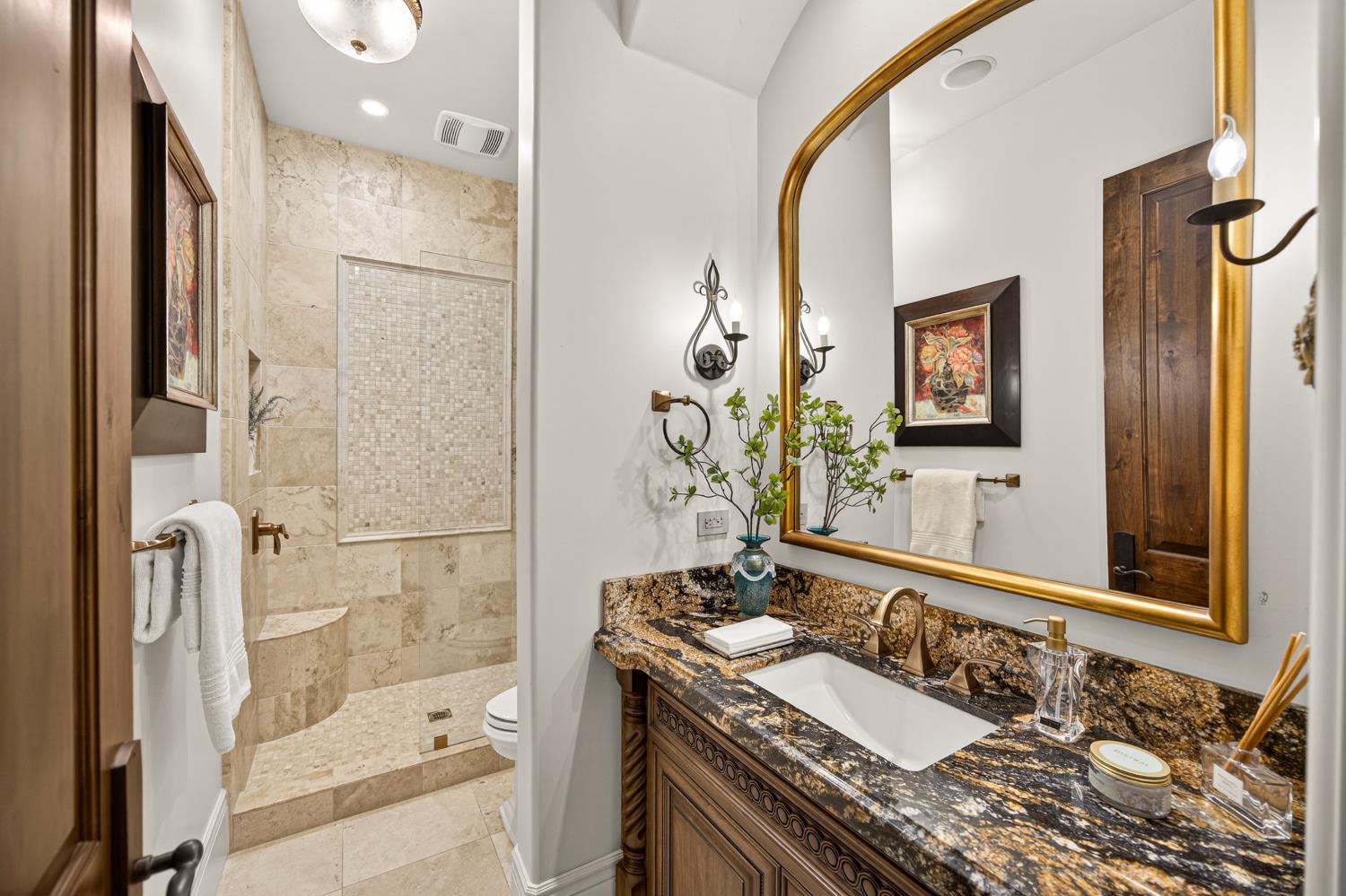 3909 Edgevale Court Fair Oaks, CA 95628 - Photo 60 of 98 a bathroom with a granite countertop sink a mirror and a shower