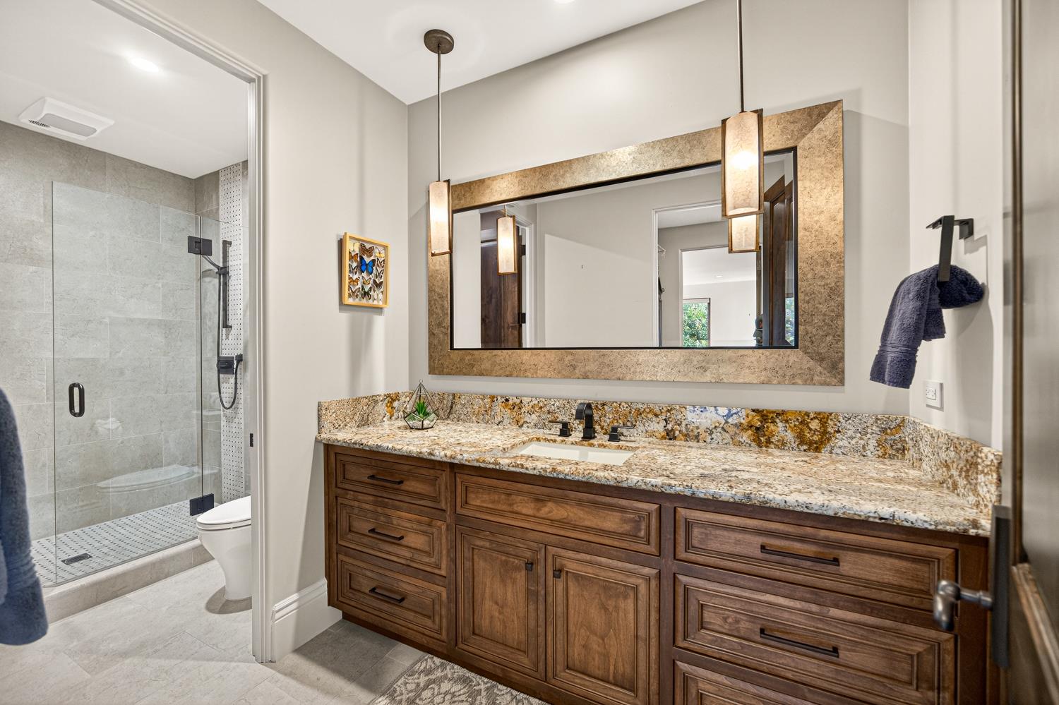 3909 Edgevale Court Fair Oaks, CA 95628 - Photo 64 of 98 a bathroom with a sink double vanity granite tub shower and a mirror