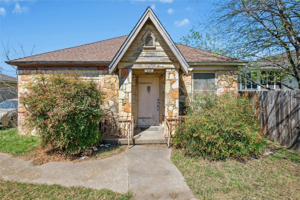 4310 Red River Street Austin, TX 78751 - Photo 2 of 5 a view of a white house with a small yard and potted plants