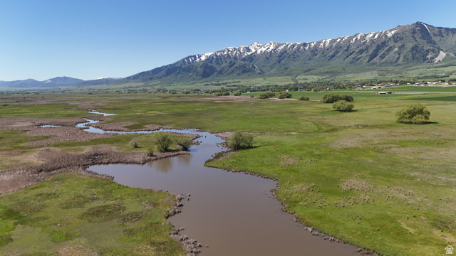 320 South 5400 West Logan, UT 84321 - Photo 20 of 42 Expansive green landscape with a winding waterway
