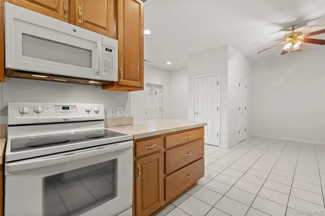 a spacious bedroom with a bed and a couch