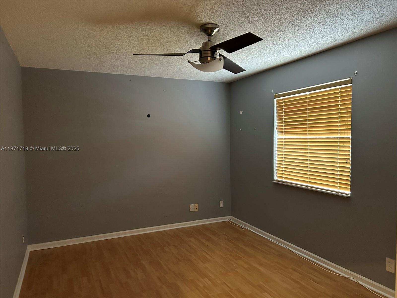 15851 Southwest 10th Street, Unit 15851 Pembroke Pines, FL 33027 - Photo 12 of 17 a view of an empty room with a window