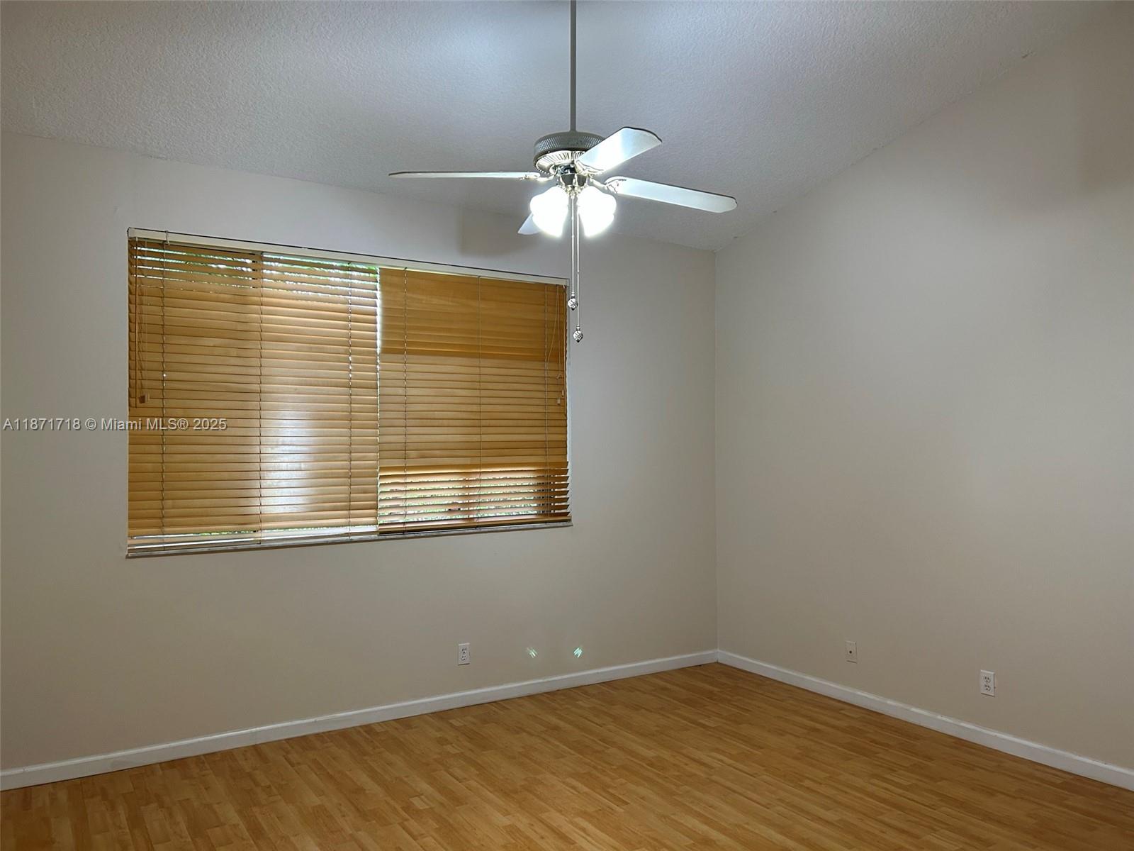 15851 Southwest 10th Street, Unit 15851 Pembroke Pines, FL 33027 - Photo 14 of 17 a view of a livingroom with a window