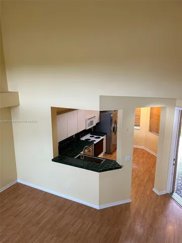 a bed sitting in a room next to a window