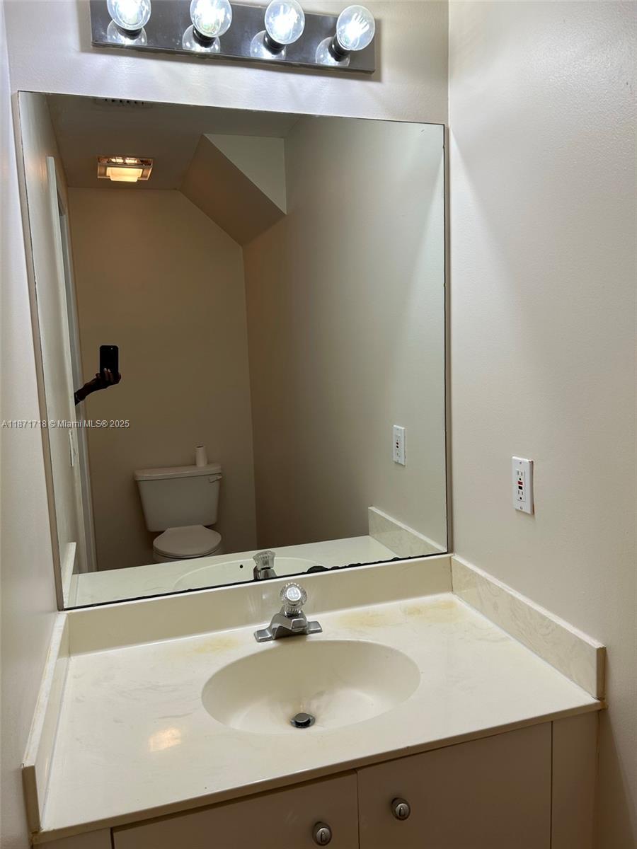 15851 Southwest 10th Street, Unit 15851 Pembroke Pines, FL 33027 - Photo 7 of 17 a bathroom with a sink and a mirror
