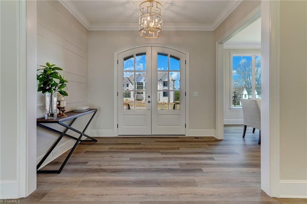 6806 Brennan Way Oak Ridge, NC 27310 - Photo 7 of 50 grand double door entry and foyer welcomes you into the great room, with the dining room to your left