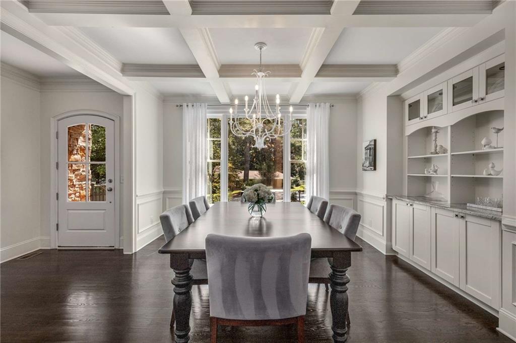 2456 Sunset Drive Northeast Atlanta, GA 30345 - Photo 12 of 49 a view of a dining room with furniture window and wooden floor