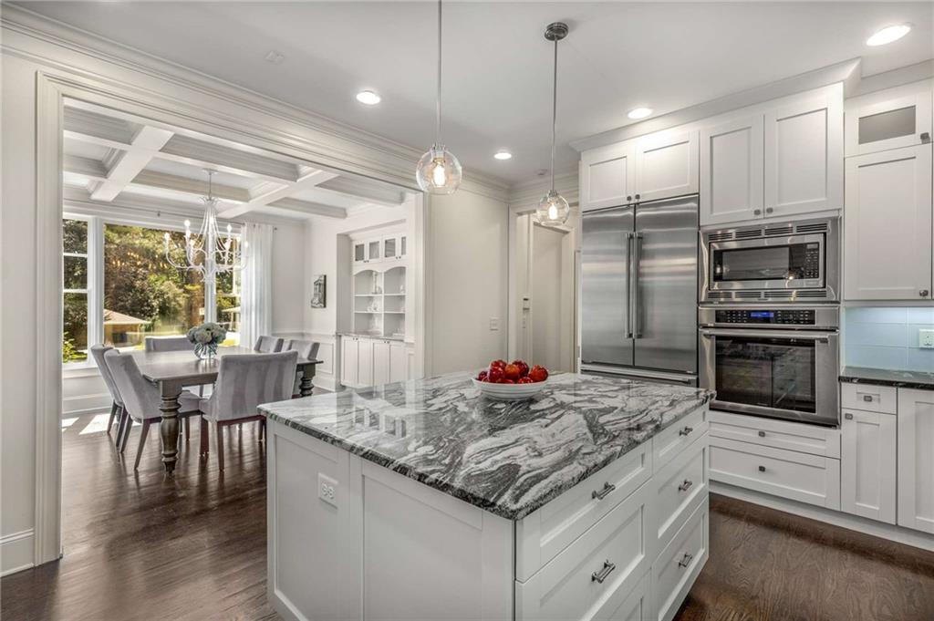 2456 Sunset Drive Northeast Atlanta, GA 30345 - Photo 15 of 49 a kitchen with stainless steel appliances granite countertop a stove and a refrigerator