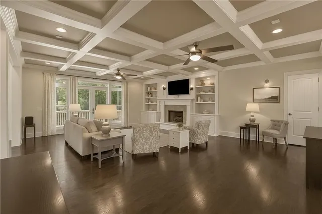 a living room with fireplace furniture and a wooden floor