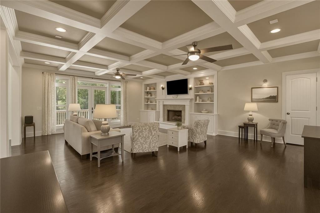 2456 Sunset Drive Northeast Atlanta, GA 30345 - Photo 19 of 49 a living room with fireplace furniture and a wooden floor