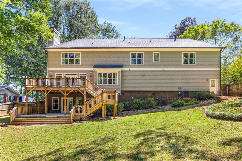 2456 Sunset Drive Northeast Atlanta, GA 30345 - Photo 2 of 49 a front view of a house with garden