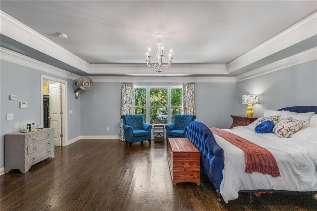 2456 Sunset Drive Northeast Atlanta, GA 30345 - Photo 23 of 49 a bedroom with furniture wooden floor and a window