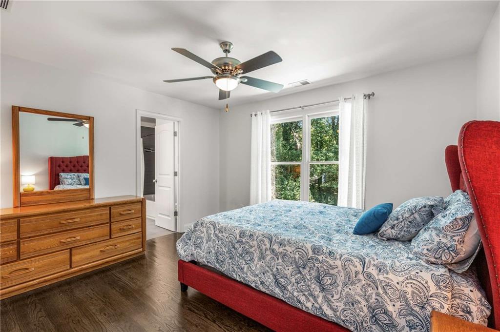 2456 Sunset Drive Northeast Atlanta, GA 30345 - Photo 32 of 49 a bedroom with a large bed and a window