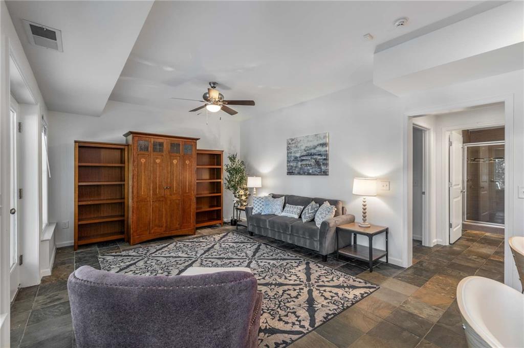 2456 Sunset Drive Northeast Atlanta, GA 30345 - Photo 43 of 49 a living room with furniture ceiling fan and a rug