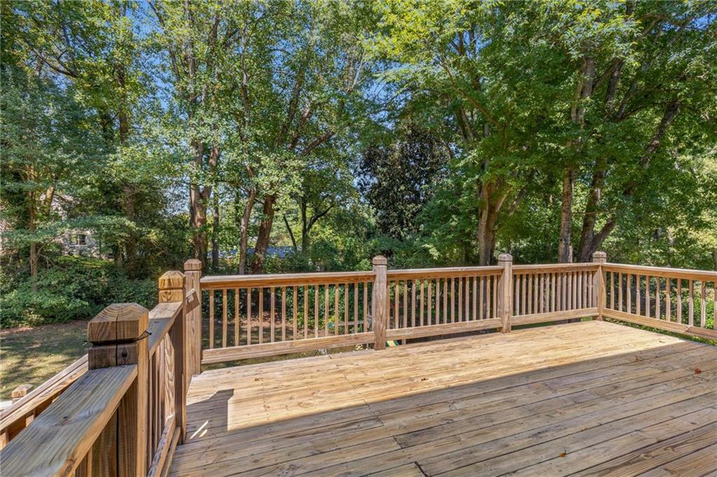 2456 Sunset Drive Northeast Atlanta, GA 30345 - Photo 45 of 49 a view of deck with a table and chairs