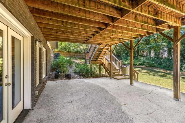 a view of a wooden deck with a backyard