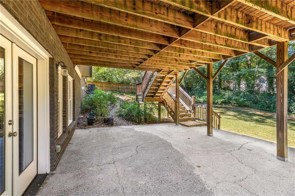 2456 Sunset Drive Northeast Atlanta, GA 30345 - Photo 47 of 49 a view of a wooden deck with a backyard