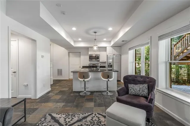 a living room with a couch and a large window