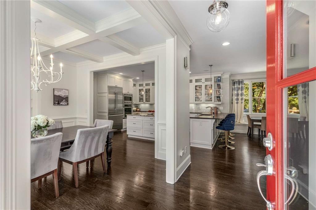 2456 Sunset Drive Northeast Atlanta, GA 30345 - Photo 10 of 49 a dining room with furniture and wooden floor