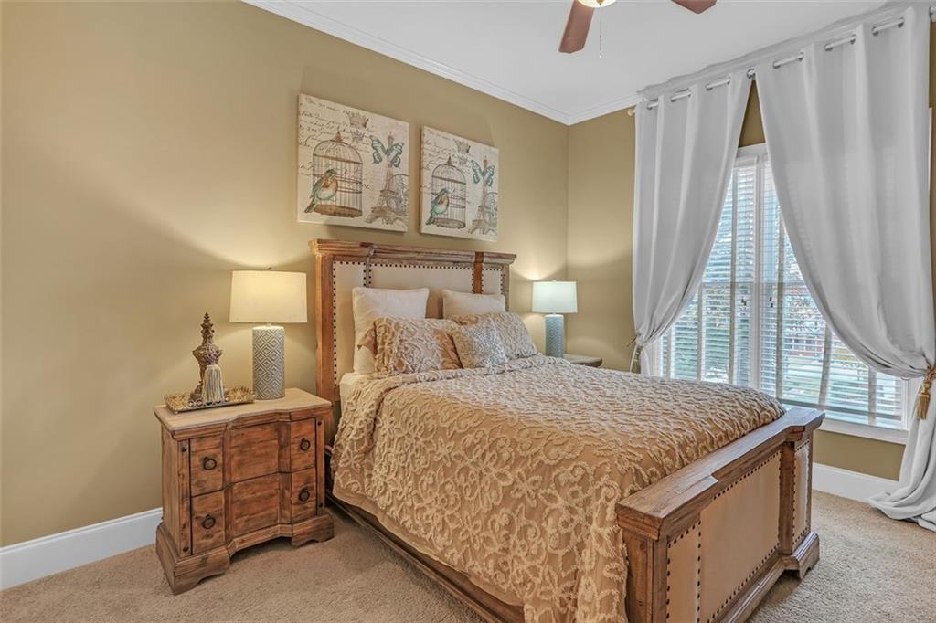 1385 Harris Road Lawrenceville, GA 30043 - Photo 15 of 76 a bed room with a bed and a window