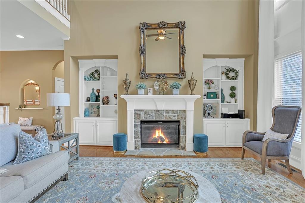 1385 Harris Road Lawrenceville, GA 30043 - Photo 20 of 76 a living room with furniture and a fireplace