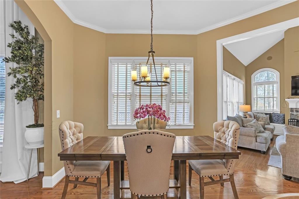 1385 Harris Road Lawrenceville, GA 30043 - Photo 21 of 76 a living room with furniture and a chandelier