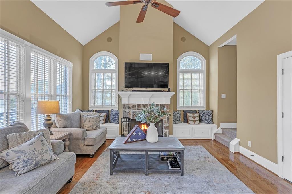 1385 Harris Road Lawrenceville, GA 30043 - Photo 22 of 76 a living room with furniture a large window and a clock