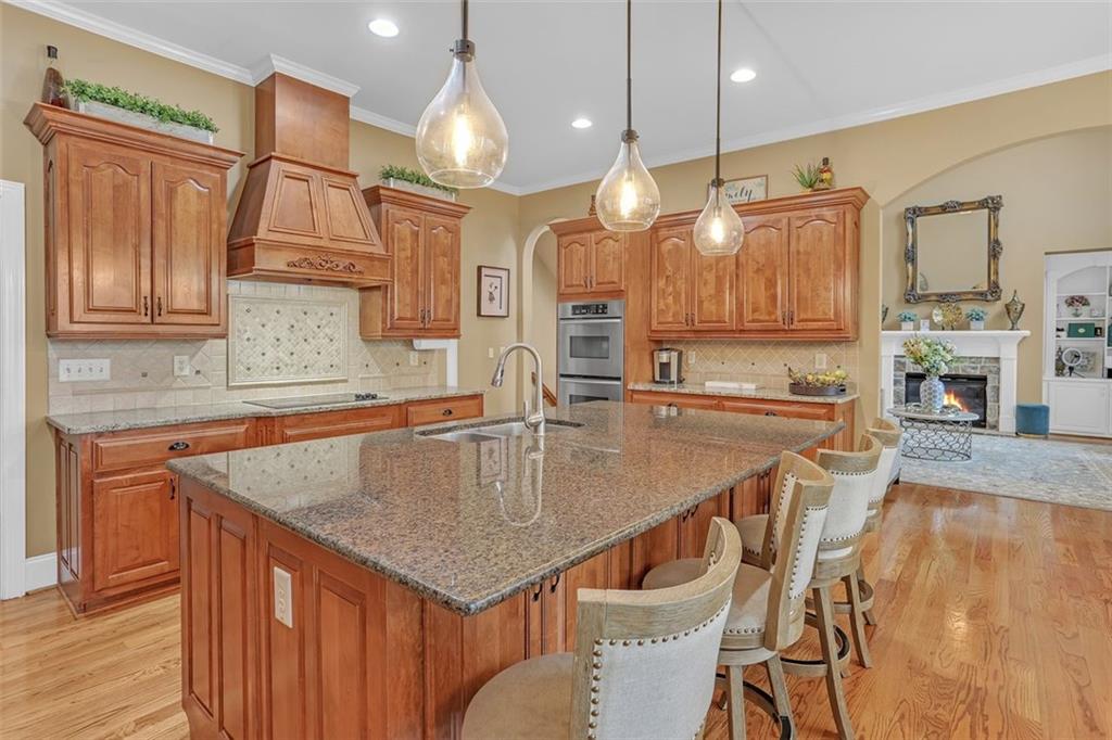 1385 Harris Road Lawrenceville, GA 30043 - Photo 25 of 76 a kitchen with stainless steel appliances granite countertop a sink a microwave oven and a refrigerator