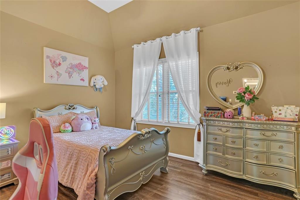 1385 Harris Road Lawrenceville, GA 30043 - Photo 37 of 76 a bed room with a bed and a dresser