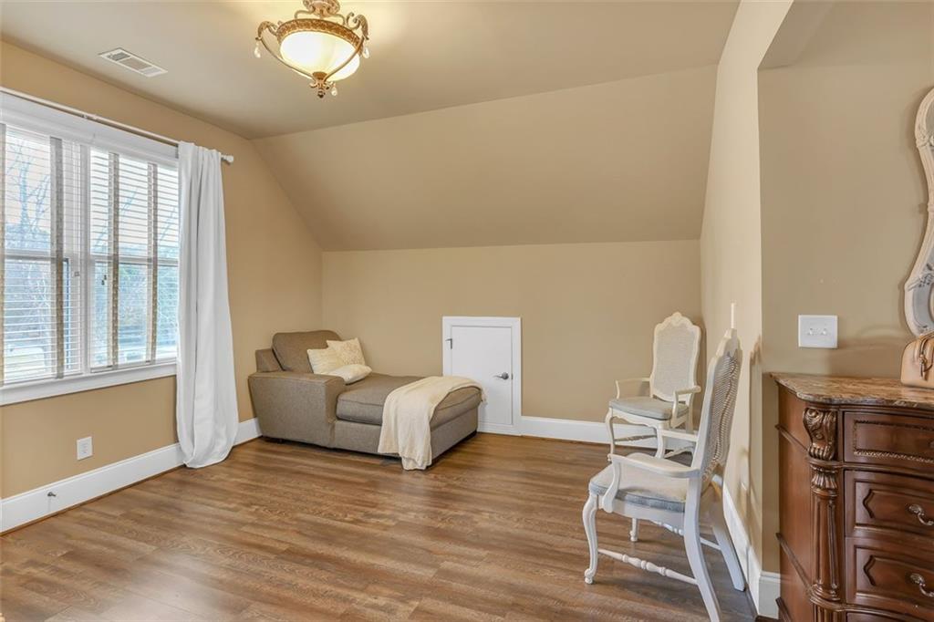 1385 Harris Road Lawrenceville, GA 30043 - Photo 44 of 76 a living room with furniture window and wooden floor