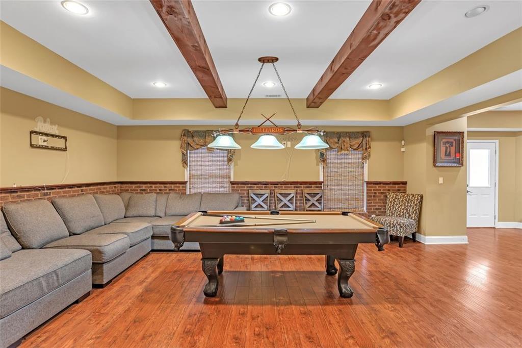 1385 Harris Road Lawrenceville, GA 30043 - Photo 50 of 76 a living room with furniture and wooden floor