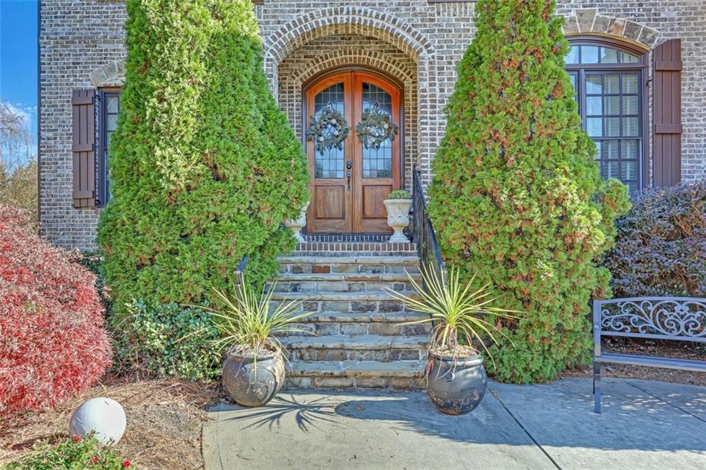 1385 Harris Road Lawrenceville, GA 30043 - Photo 5 of 76 a front view of a house with garden