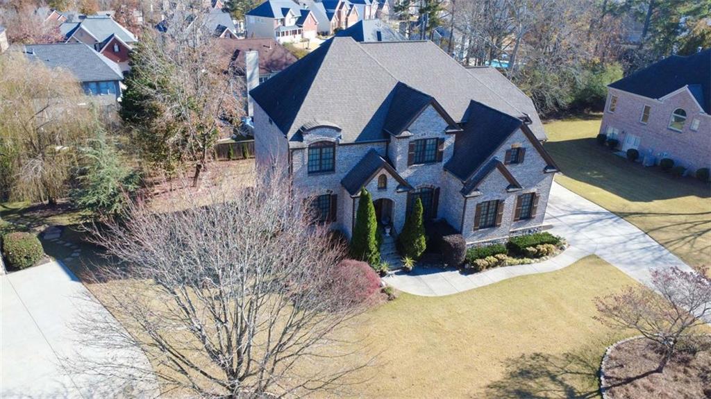 1385 Harris Road Lawrenceville, GA 30043 - Photo 70 of 76 a aerial view of a house with a yard