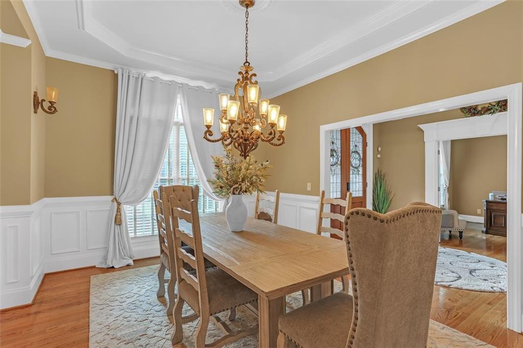 1385 Harris Road Lawrenceville, GA 30043 - Photo 10 of 76 a dining room with furniture and window