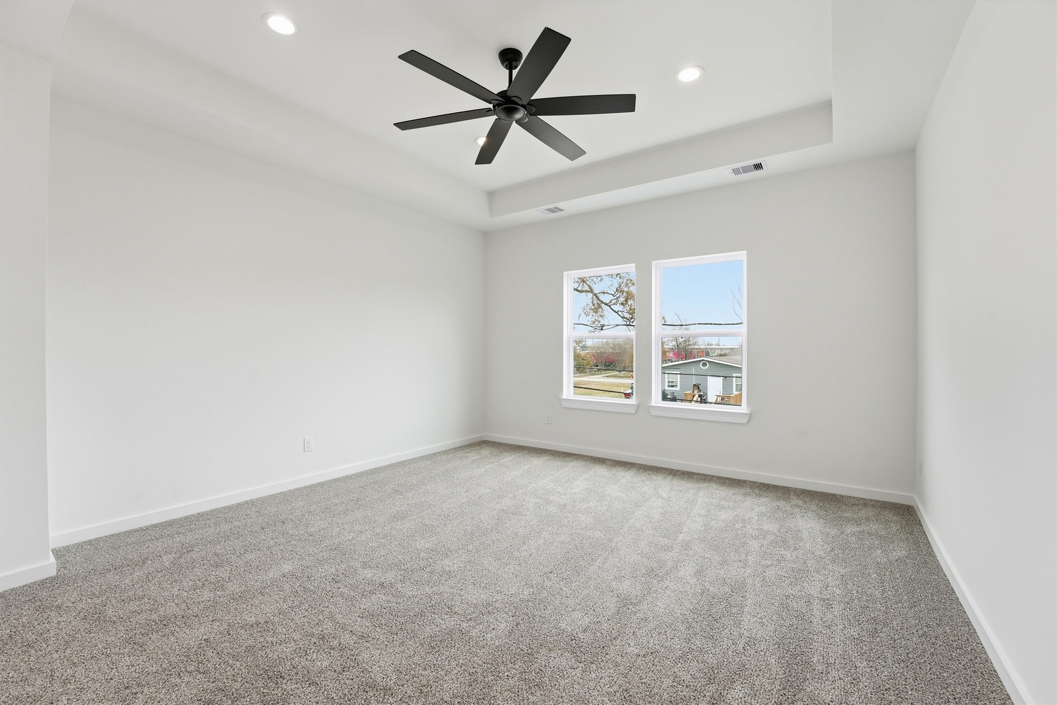 524 North 4th Street La Porte, TX 77571 - Photo 20 of 25 an empty room with windows and fan