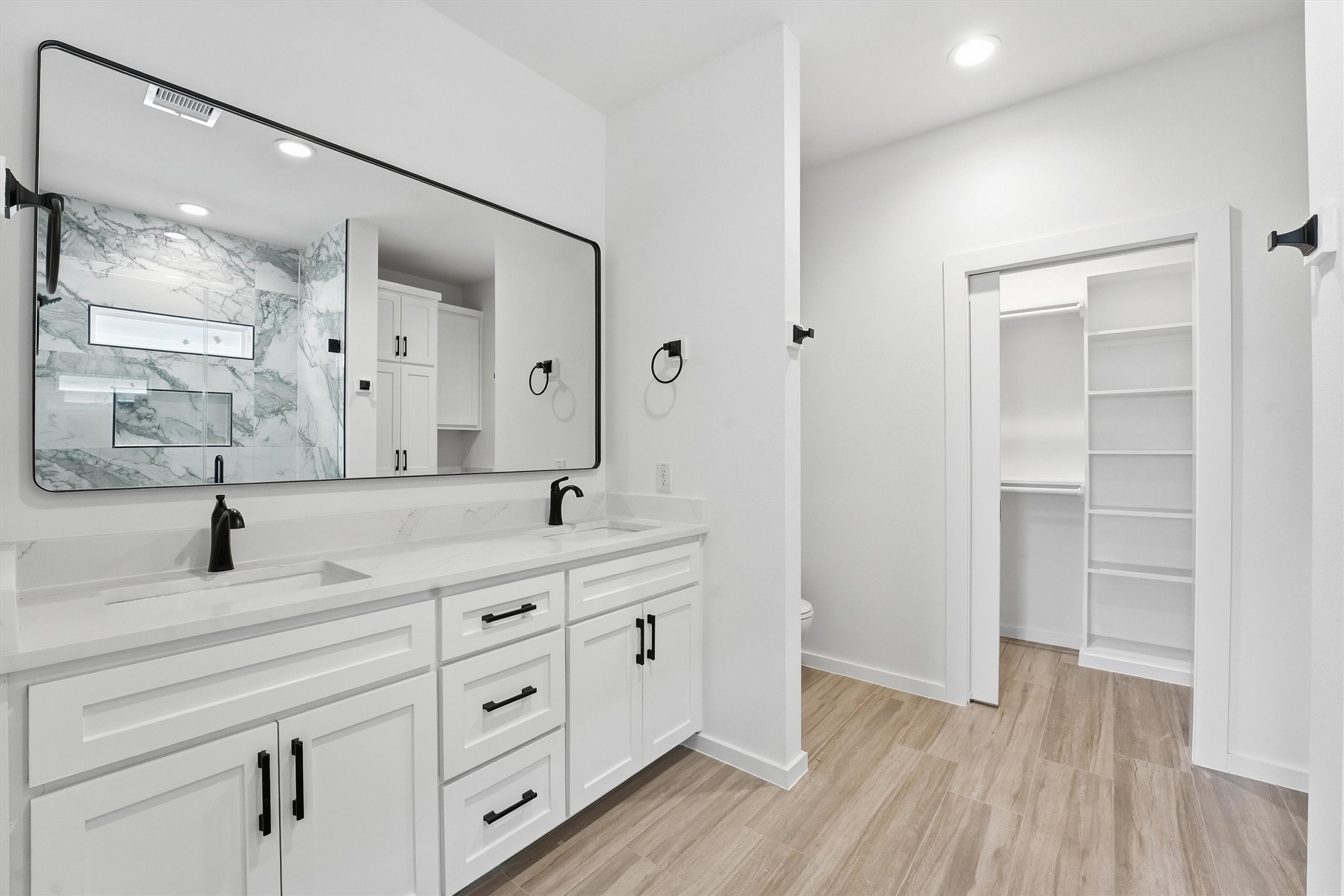524 North 4th Street La Porte, TX 77571 - Photo 21 of 25 a spacious bathroom with a double vanity sink a mirror and a shower