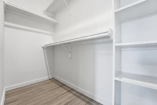 a view of an empty walk in closet