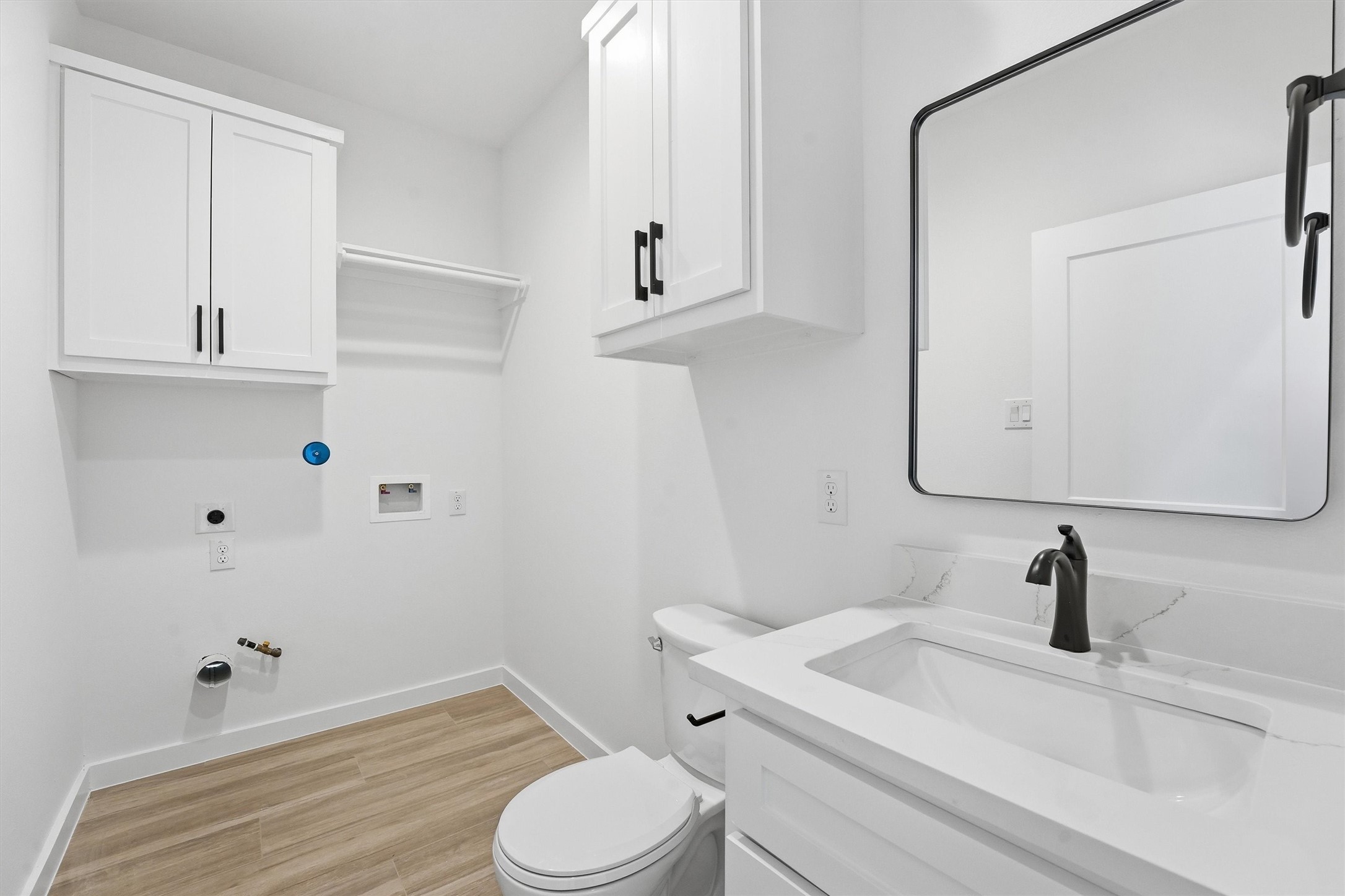 524 North 4th Street La Porte, TX 77571 - Photo 6 of 25 a bathroom with a sink a toilet and mirror