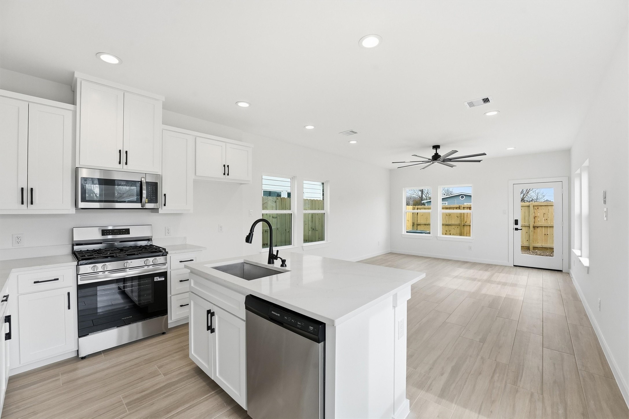 524 North 4th Street La Porte, TX 77571 - Photo 7 of 25 a kitchen with stainless steel appliances a sink stove and cabinets