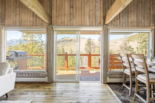 a view of a room that has a bed and a window