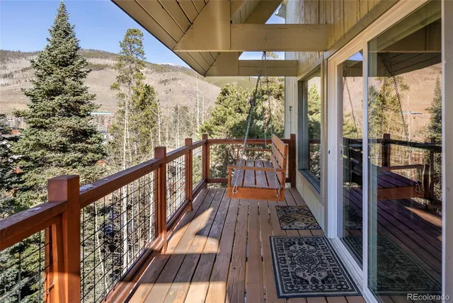 a view of a balcony with wooden floor
