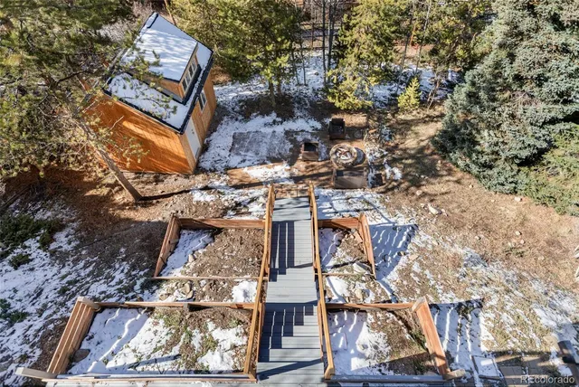 front view of a house with a tree
