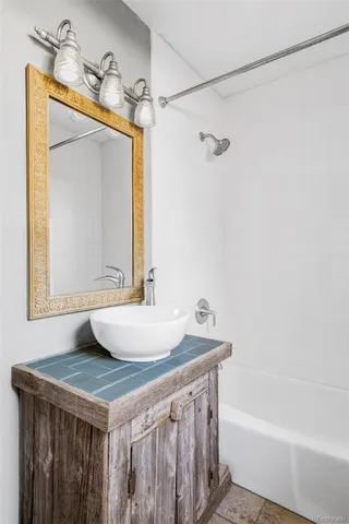 a bathroom with a sink and a mirror